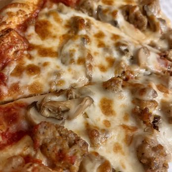 Marco's Pizza - a close up of a pizza - Italian Near Me - Hutto, Texas Marco's Pizza - a close up of a pizza - Italian Near Me - Hutto, Texas
