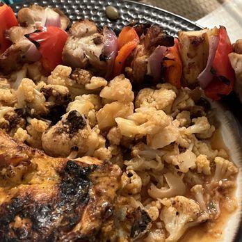 Nando's Peri-Peri - 1/2 chicken (medium spicy), golden cauliflower and chicken skewer. - Portuguese Near Me - Silver Spring, Maryland
