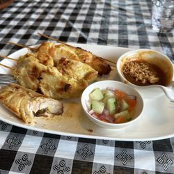 Thai Charlie's Restaurant - Thai Satay Chicken with Peanut sauce (4 pcs). They are the size of half a chicken breast each