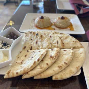 Bosphorus Turkish Cuisine - Pita bread with delicious condiments -- butter, olives and cheese - Turkish Near Me - Rocklin, California Bosphorus Turkish Cuisine - Pita bread with delicious condiments -- butter, olives and cheese - Turkish Near Me - Rocklin, California