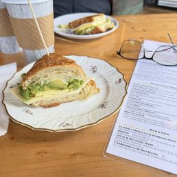 Croissant avocado egg cheese sandwich
