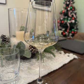 Monochrome Wines - a glass of wine on a table - Wine Tasting Room Near Me - Paso Robles, California