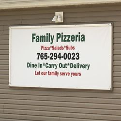 Family Pizzeria - Contact number. Front of building.