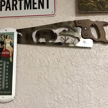 Nebraska Barn And Grill - Cool looking saw with buffalo cut out. One of many different decorations inside. - Steakhouses Near Me - Gothenburg, Nebraska