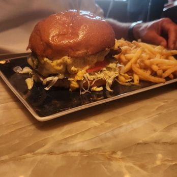 Reunion Kitchen + Drink - Gourmet cheddar burger, saucy and messy! - New American Near Me - Brea, California