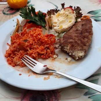 Restaurant Bosna - Bosnische Pljeskavica with Djuvec rice and Schafkäse. A little late on the picture but it smelled so good I dove in. Yummy. - German Near Me - Grainau, BY