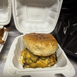 B-More Mojo Kitchen & Carryout - Steak Burger with pickles cheese and grilled onions