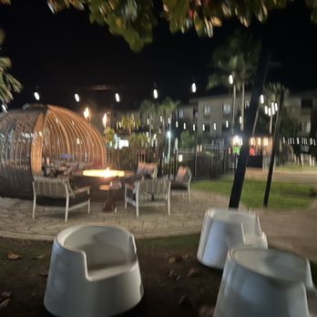Courtyard by Marriott Oahu North Shore - Night by the pool is warm enough in winter to swim or just enjoy a snack with live guitar & vocals. - Hotels Near Me - Laie, Hawaii