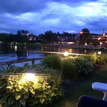 Lago - Our view with glass of wine, amazing crispy calamari and delicious mussels served in a huge cast iron bowl with crusty bread! - Italian Near Me - Meredith, New Hampshire