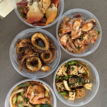Konohiki Seafoods - Left to right, top to bottom: Surf clam, Korean tako poke, calamari, tofu poke, kimchi shrimp - Seafood Near Me - Lihue, Hawaii Konohiki Seafoods - Left to right, top to bottom: Surf clam, Korean tako poke, calamari, tofu poke, kimchi shrimp - Seafood Near Me - Lihue, Hawaii