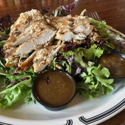 Louie's Place Saloon and Grill - Blue cheese. Walnuts, cranberries, salad topped w/2 fresh chicken breasts sliced. Homemade dressing!