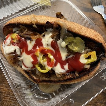 Loving Hut - a half eaten sandwich in a plastic container - Vegan Near Me - Cincinnati, Ohio Loving Hut - a half eaten sandwich in a plastic container - Vegan Near Me - Cincinnati, Ohio