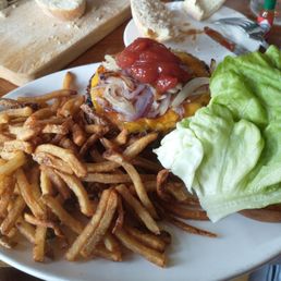 Cheese burger with fries.