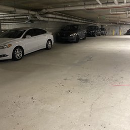 Full parking garage, cars parked on the walls. Full parking garage, cars parked on the walls.