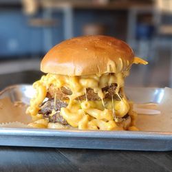 Urban Skillet Northridge - SMAC N' CHEESE BURGER- Smashed Double Patties, Onion Ring, Mac N Cheese, Urban Sauce, American Cheese, and Pickles
