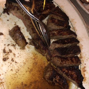 Peter Luger - T-Bone steak cooked medium well perfectly - Steakhouses Near Me - Brooklyn, New York