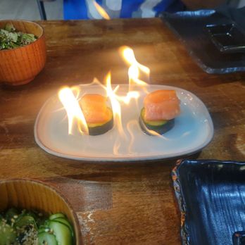 American Japa Sushi - a plate of sushi with flames - Sushi Bars Near Me - Orlando, Florida