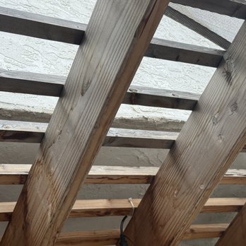 Superior Painting - Stucco damage and weathered wood pergola. - Painters Near Me