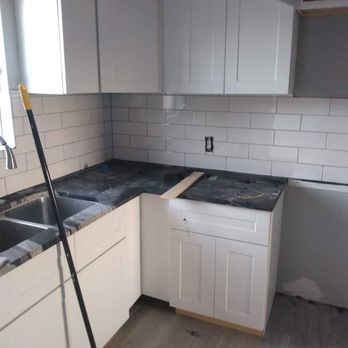 Jeannie's Remodeling and Construction - Installed cabinets, painted, did back-splash, and flooring - General Contractors Near Me