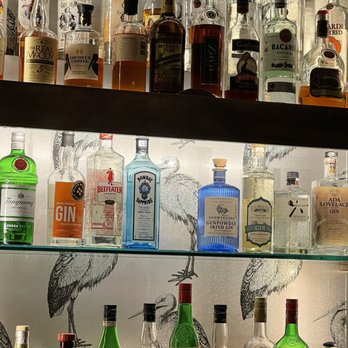 Erie Grill - a shelf full of liquor bottles - New American Near Me - Pittsford, New York Erie Grill - a shelf full of liquor bottles - New American Near Me - Pittsford, New York