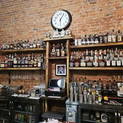 1838 Bourbon and Wine Bar - Variety of liquids and bourbons.