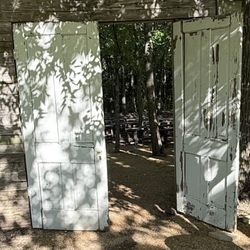 Magnolia Grace Ranch - Broken right door. The rock is barely holding the door in place and can't be moved.