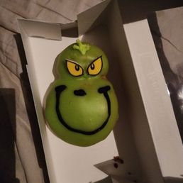 They made a Grinch green donut With icing and filling They made a Grinch green donut With icing and filling