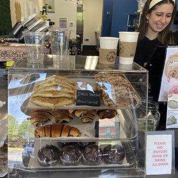 Bean ‘N Breek Coffee - This is the pastry case cheese danish, almond croissant, rugelach, chocolate muffin and cookies and the young lady is the barista - Coffee & Tea Near Me - Tinley Park, Illinois Bean ‘N Breek Coffee - This is the pastry case cheese danish, almond croissant, rugelach, chocolate muffin and cookies and the young lady is the barista - Coffee & Tea Near Me - Tinley Park, Illinois