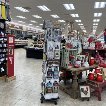 Buc-ee’s - A store interior features a display of holiday-themed ceramics, decorations, and mannequins, with grocery aisles and signage visible in the background. - Gas Stations Near Me - Saint Augustine, Florida