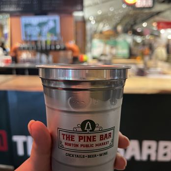 The Pine Bar - a person holding a cup of coffee - Wine Bars Near Me - Boston, Massachusetts The Pine Bar - a person holding a cup of coffee - Wine Bars Near Me - Boston, Massachusetts