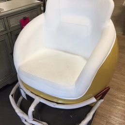 Unusual item - chair made like a football helmet for the football fan. Hmmm...San Francisco 49er colors, one of my favorite teams.