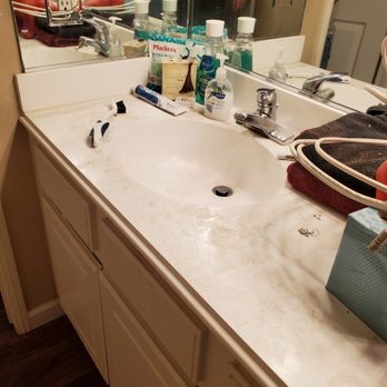 Empire Today - Bathroom counter tops full of dirt and dust. These should have been wiped down. - Flooring Near Me