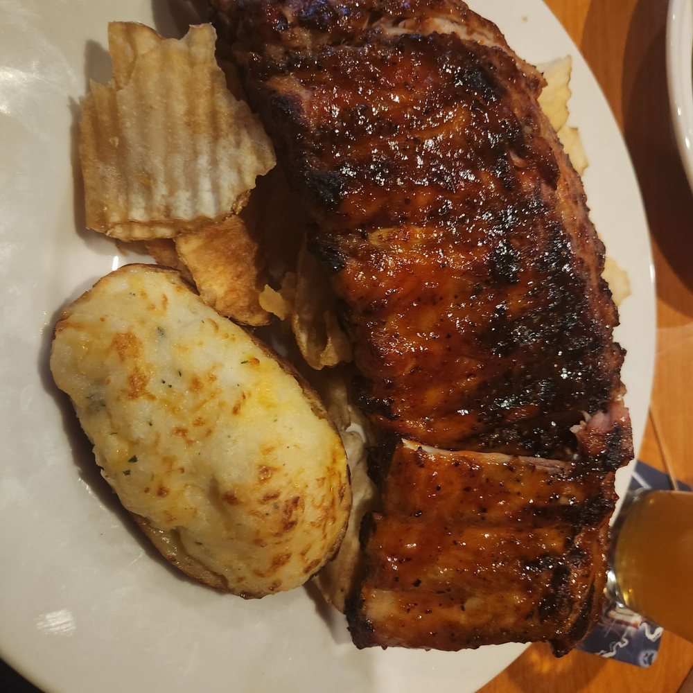 Otis & Oliver's - Full rack of rubs. With Saratoga Chips and double bakes mashed potato. - New American Near Me - Latham, New York