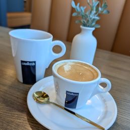 Black coffee and Carmel Macchiato. Lavazza beans Black coffee and Carmel Macchiato. Lavazza beans
