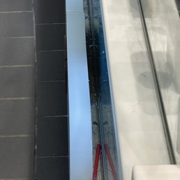 Glass and trash around the sign