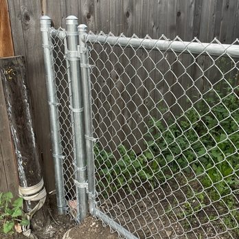 Northwest Fence Co - Side Gate. Special care taken with a gate over a drain ditch. Rocks were added to keep the small dogs inside. - Fences & Gates Near Me - Spokane Valley, Washington Northwest Fence Co - Side Gate. Special care taken with a gate over a drain ditch. Rocks were added to keep the small dogs inside. - Fences & Gates Near Me - Spokane Valley, Washington