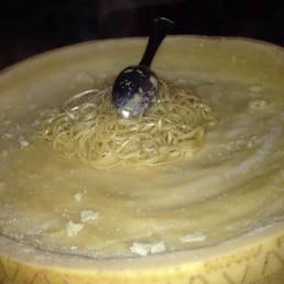 Parmesan Cheese wheel that is scraped then tossed with the butter Linguine and topped with shaved black truffle. To die for! Parmesan Cheese wheel that is scraped then tossed with the butter Linguine and topped with shaved black truffle. To die for!