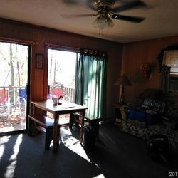 Laurel Leaf Cabins - A great way to enjoy a cup of coffee while looking out through the sliding glass doors and watching the leaves dance and fall as they will!