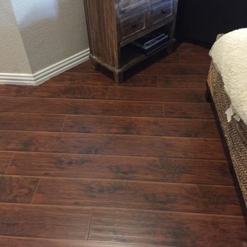Floors 4 Less - a corner of a room with a bed and a tv - Flooring Near Me - Frisco, Texas Floors 4 Less - a corner of a room with a bed and a tv - Flooring Near Me - Frisco, Texas