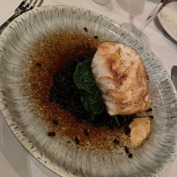 Napa Cafe - Sea bass with spinach and forbidden rice - such a great miso dressing! - New American Near Me - Memphis, Tennessee
