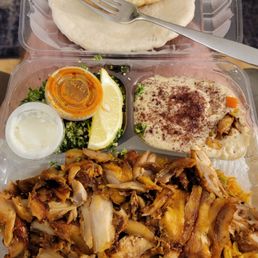 Chicken Shawerma dinner w/half curry rice, half Tabuli and hummus, incl. side of garlic sauce & medium spice paste, w/an extra order of pita Chicken Shawerma dinner w/half curry rice, half Tabuli and hummus, incl. side of garlic sauce & medium spice paste, w/an extra order of pita