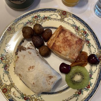 Follansbee Inn - Plated Breakfast tortillas aka at The Follansbee Inn as the Wadleigh Wrap, Angel Biscuits, Mini whole potatoes and fresh fruit. - Bed & Breakfast Near Me - North Sutton, New Hampshire