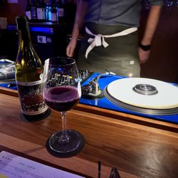 Beer, wine, thousands of vinyl records. Music always played at a polite volume.
