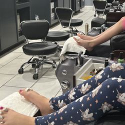Reach Nails And Spa II - My girls enjoying the massage chairs after their pedicures were done.