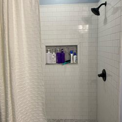 Hilltop Renovations - New shower and freestanding tub installed. Marble and subway tile. Grey epoxy grout for a long clean grout life.