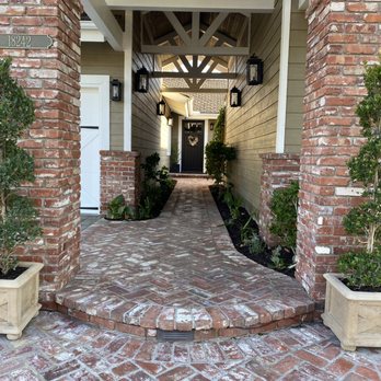 Gonzalez Misael Landscaping - Picked up the spiral topiaries and planted, as well as all of our cuttings in the front walkway! - Landscaping Near Me Gonzalez Misael Landscaping - Picked up the spiral topiaries and planted, as well as all of our cuttings in the front walkway! - Landscaping Near Me