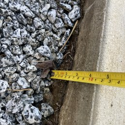 Example of the ground sink. Those rocks were level with the patio. Example of the ground sink. Those rocks were level with the patio.