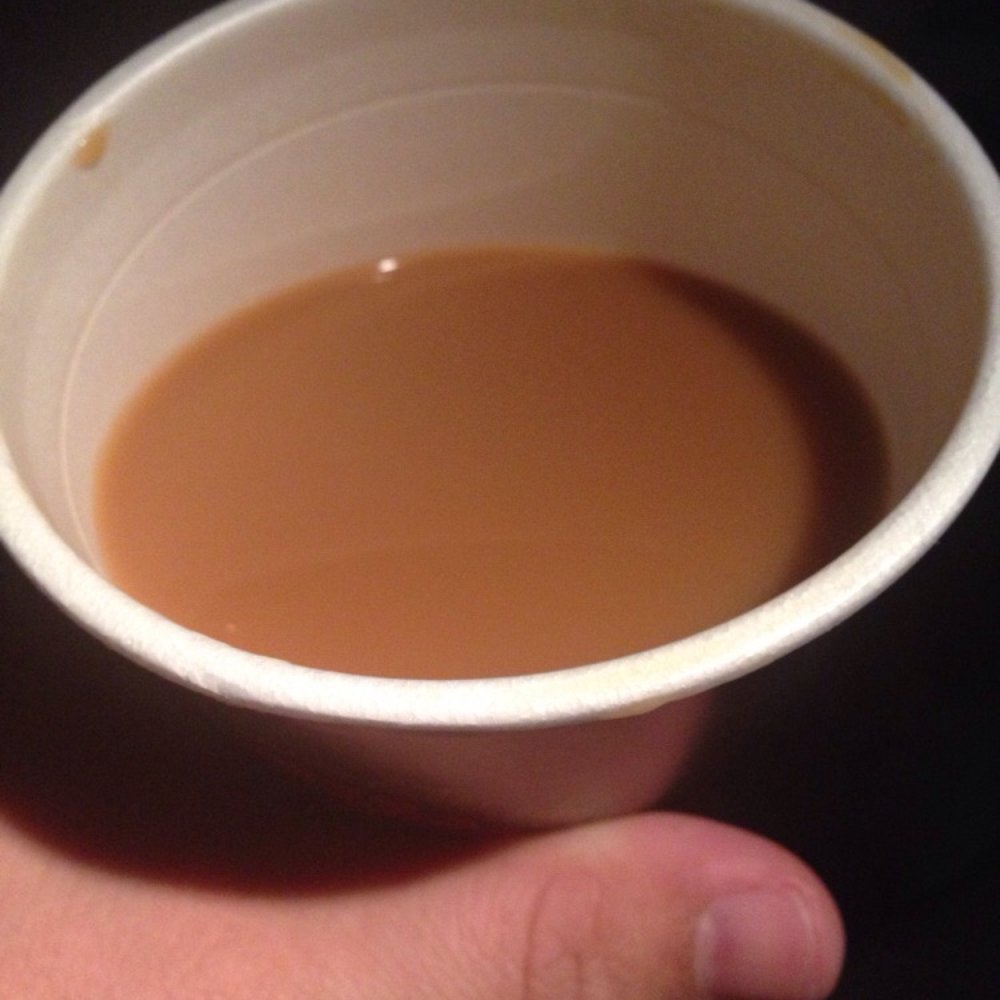 This is the half cup of cold swill I was given when I ordered a large hot coffee!