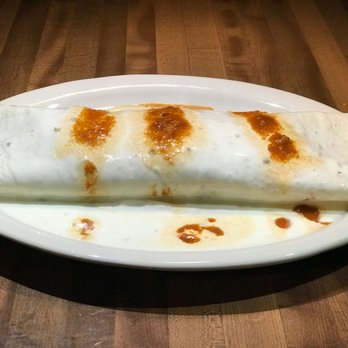 El Ranchito - a burrito on a white plate - Mexican Near Me - Marion, Illinois El Ranchito - a burrito on a white plate - Mexican Near Me - Marion, Illinois