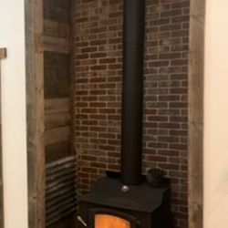 Flint Valley Home Services - Brick wall with Barnwood and tin accents.